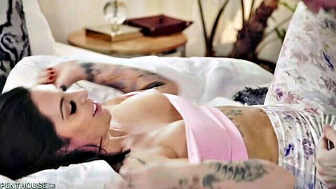 Tattooed Latina brunette in pink top and pajamas during intimate morning encounter