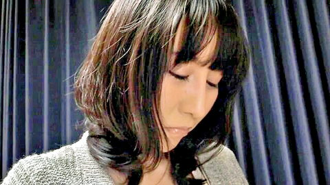 Seductive Asian MILF with dark bangs and nice body close-up