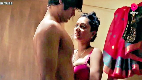 Indian bhabhi in pink lingerie seducing shirtless hunk, intimate close-up