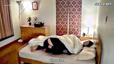 Asian woman nude on bed, butt exposed in late night JAV cuckold scene