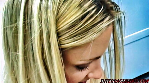 Blonde woman seductive smile close-up in slutty anal interracial video