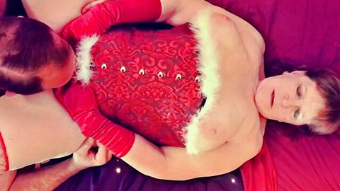 Bald man roughly gropes mature granny BBW's huge saggy tits in red Santa corset lingerie