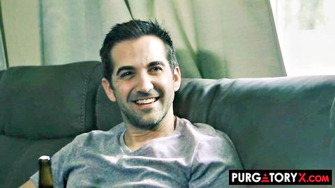Hunky Jaye Summers smiling in gray t-shirt, holding beer in PurgatoryX scene
