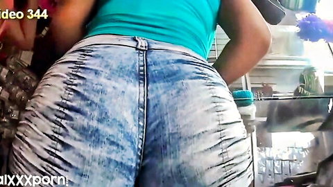 Big booty babe teasing in tight ripped denim shorts from behind