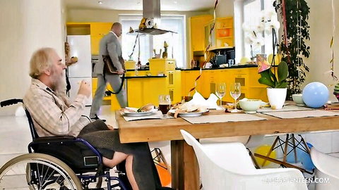 Charli Red All Inside the Family Ep 4: Elderly bearded man in wheelchair with suited man at table