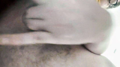 Blurry close-up of man kneeling over camera jerking off in bath