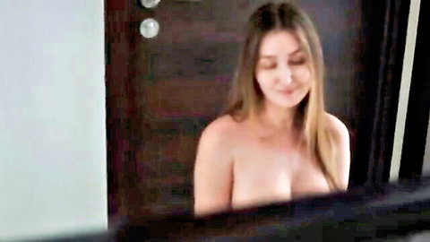 Topless brunette stepmom smiling seductively, bare breasts exposed, tempting stepson