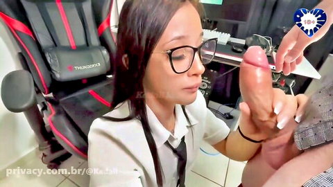 Asian student in glasses and uniform sucking large dildo in teacher fantasy scene