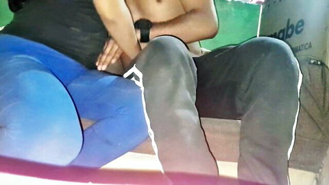 Andresy and Xiomy in intimate post-graduation embrace, shirtless man and woman in tight blue pants