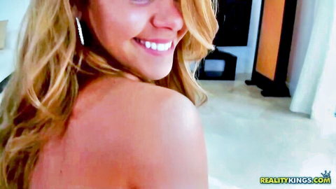 Elizabeth Bentley perky blonde smiling over shoulder in nude trailer