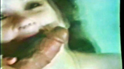 Chrissie Beauchamp sucking Ron Jeremy's cock in close-up oral scene
