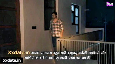 Indian taxi driver in checkered shirt stands in hallway, teasing adult hookup scene