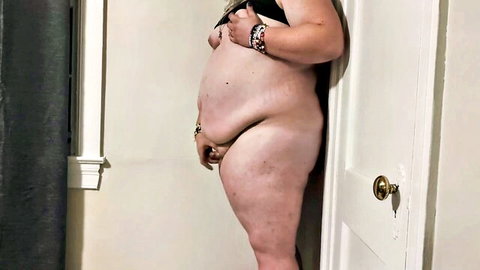 Aura Flowers pregnant BBW leaning against wall, nude with dragon dildo