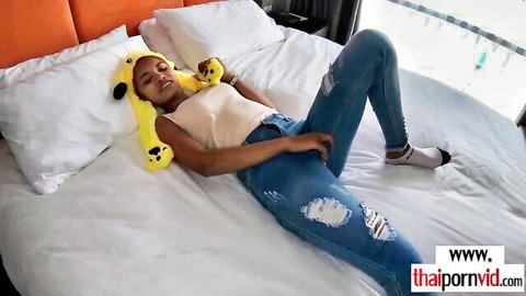 Thai teen Cherry teases in ripped jeans and plush hat, legs spread