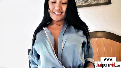 Thai amateur babe in silk robe smiling flirtatiously