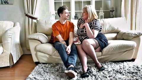 Catherine Can sexy granny with young stud on sofa, intimate moment