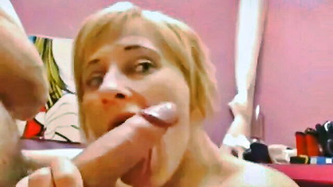 Platinum blonde cougar giving intense blowjob closeup