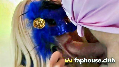 Amy Azurra in seductive blue feathered mask, blonde hair, open mouth tease