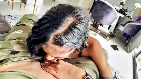 Ebony girlfriend with curly hair sucks boyfriend's nipple passionately in amateur video