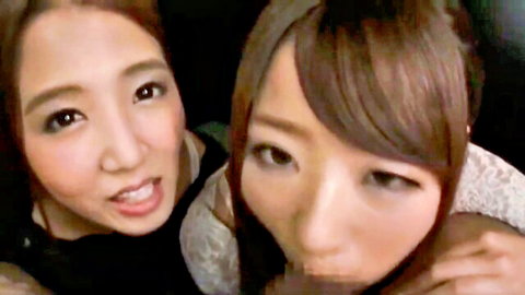 Two sexy Asian babes puckering plump lips in close-up kissy selfie