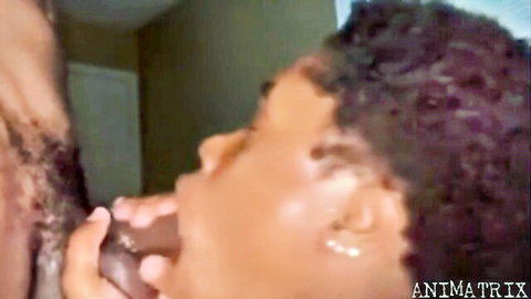 Ebony babe sucking massive black cock with hand gripping shaft closeup