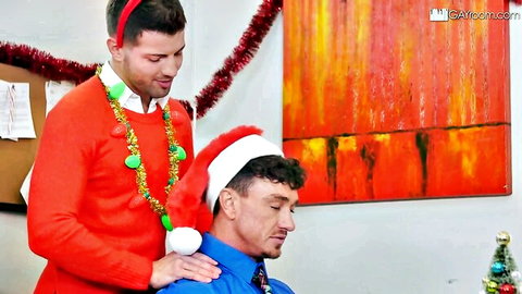 Sexy elf in red sweater gropes Santa-hatted guy's shoulder in gay Christmas office tease
