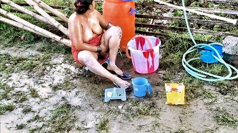 Desi mature woman topless outdoor bath exposing big tits and pussy