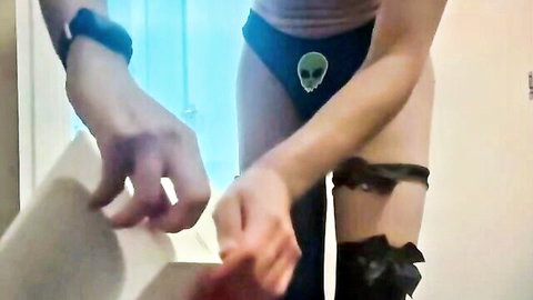 Trans femboy unboxes Apple HomePod in sexy alien underwear and thigh-high stockings