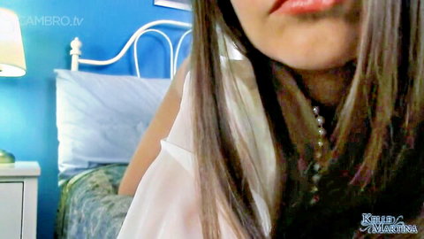 Kelle Martina in seductive close-up, long brown hair and white top tease