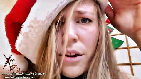 Xev Bellringer blonde in sexy Santa hat, open-mouthed Christmas tease