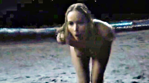 Naked blonde woman on all fours on moonlit beach with mouth open exposing medium tits and ass