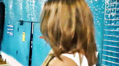 Charity Lane in wet white tank top, back view in steamy shower