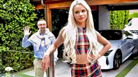 Sexy blonde teen in plaid crop top and mini skirt poses teasingly by luxury car with waving older man
