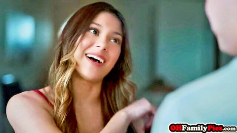 Jill Kassidy smiling excitedly in red top, Christmas giving scene