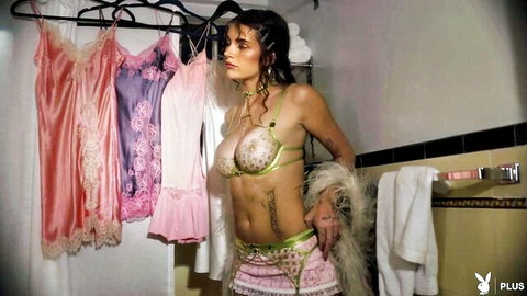 Ari Kytsya in sexy green beaded lingerie, wet brunette hair, seductive pose