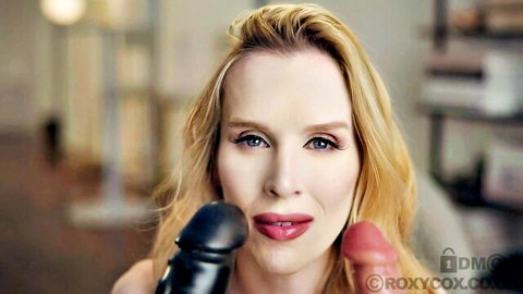 Blonde MILF teases plump red lips with huge black and red dildos