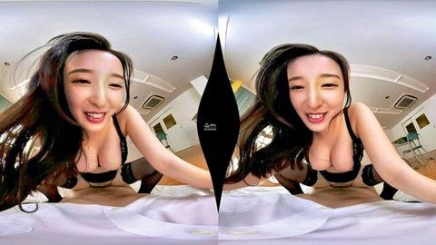 Asian babe smiles playfully with perky tits exposed in pushed-down black bra on bed VR view