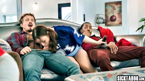 Teen in blue football jersey double teamed with blowjob by two guys