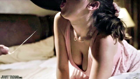 Ashley Adams in pink nightie, mouth open in ecstasy on bed