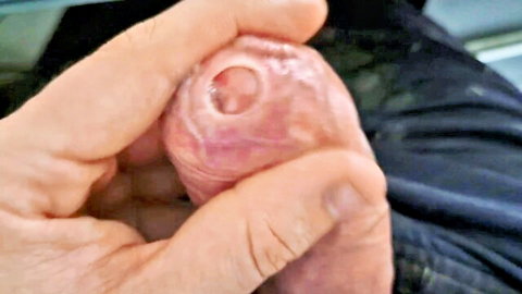 Close-up of massive uncircumcised dad cock foreskin play with precum drip