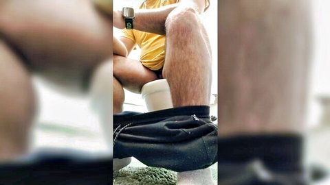 Man pants down on toilet as woman backs bare ass onto his lap in bathroom
