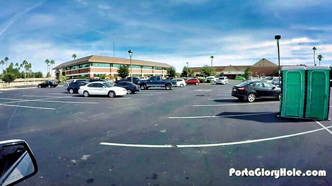 Parking lot with porta potty at PortaGloryHole.com glory hole spot ready for anonymous cock sucking