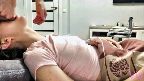 Slim Asian stepsister in pink top kissed on neck while resting on bed