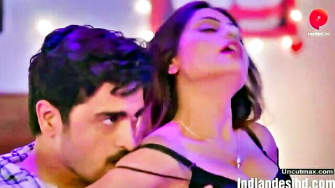 Indian woman in black lingerie embraced passionately by man in threesome scene