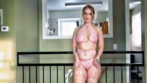 Curvy blonde in sheer pink lingerie showing hard nipples and thick thighs