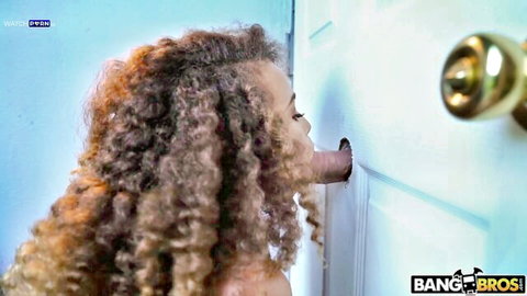 Cecilia Lion gives glory hole blowjob through door