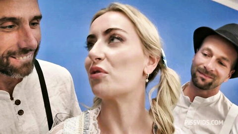 Emily Belle in dirndl at piss festival with two men, wet gangbang tease