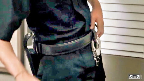 Joey Mills in tight police uniform, handcuffs and holster on belt