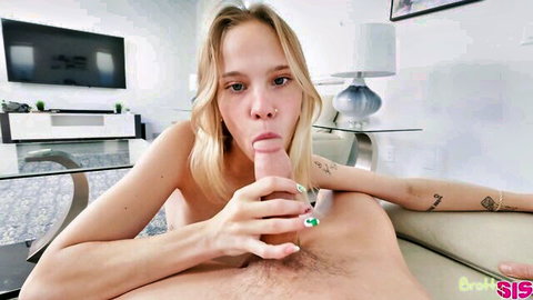 Blonde tattooed teen stepsister sucking stepbrother's thick cock on couch