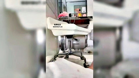 Blurry white swivel chair in bathroom with bbwrtv.com watermark, ready for femdom foot worship